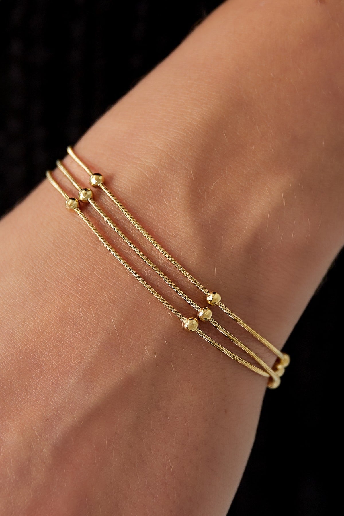 Armband met een twist goud/zilver