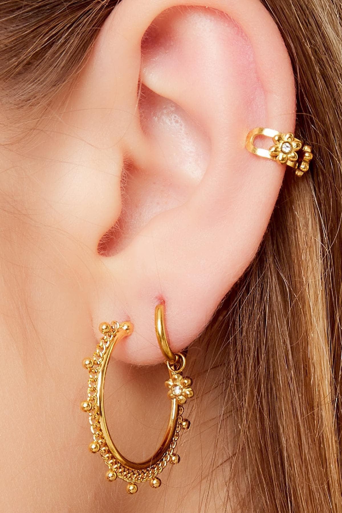 Earcuff kleine bloemen goud/zilver